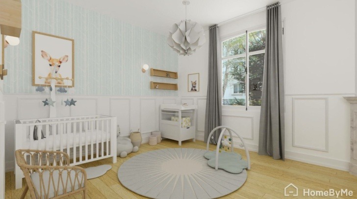 Baby girl room with light blue hints on the wall, white furniture and wooden floor.