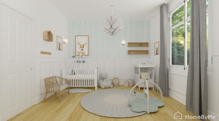 Baby girl room with light blue hints on the wall, white furniture and wooden floor.