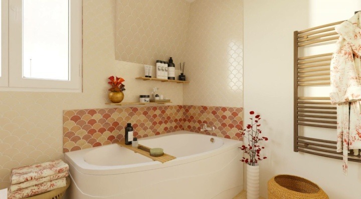 Bathtub with pink wall tiles